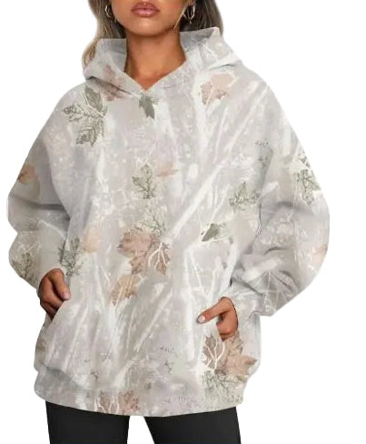 Floral-patterned poncho worn by a person on a white background